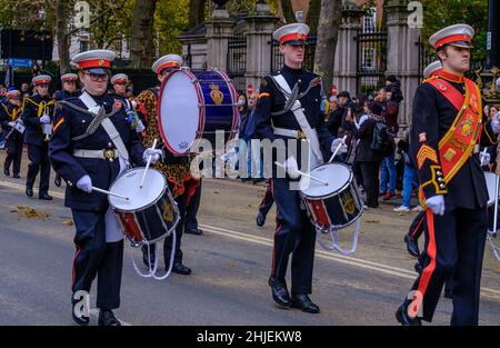 Young people & men play drums marching with the Surbiton Rbl Youth Marching Band at the Lord Mayor’s Show 2021, Victoria Embankment, London. Stock Photo