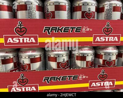Germany, Viersen - January 9. 2022: Closeup of cans astra rakete beer in shelf of german supermarket Stock Photo
