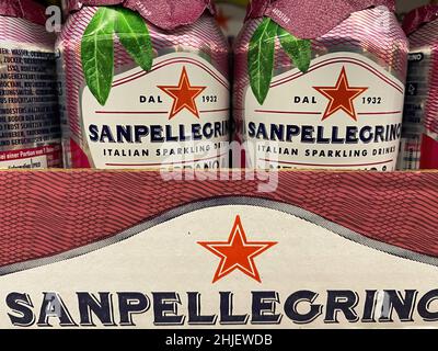 Germany, Viersen - January 9. 2022: Closeup of cans with sanpellegrino sparkling drink in shelf of german supermarket Stock Photo