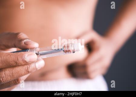 young man hand using insulin pen close up  Stock Photo