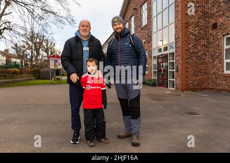 Saturday 29 January 2022 - Stockton Heath, Cheshire, England. Harvey Goodman sets off on a walk from Stockton Heath Primary School to Old Trafford Stadium in Manchester as a sponsored walk to gain money for a new school playground. He is supported by his head teacher and former Man. Utd. player Sammy McIlroy. Credit: John Hopkins/Alamy Live News Stock Photo