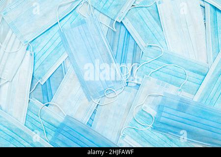 Lots of scattered medical classic blue masks. Health protection concept. Medical background. Stock Photo