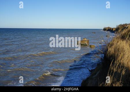 Remains of old bunkers from the World War on the banks of the Baltic Sea Stock Photo