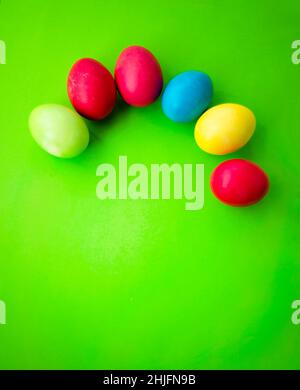 Pattern of colorful Easter eggs on a green background. Stock Photo