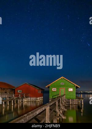 Colorful boathouses at night, Schondorf, Ammersee, Lake Ammer, Upper Bavaria, Bavaria, Germany, Europe Stock Photo