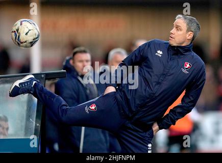 Cheltenham Town manager Michael Duff controls the ball during the Sky Bet League One match at The Jonny-Rocks Stadium, Cheltenham. Picture date: Saturday January 29, 2022. Stock Photo