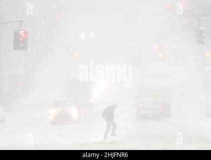 New York, United States. 29th Jan, 2022. Pedestrians cross 42nd Street as a Nor'easter with blizzard-like conditions hits the east coast in New York City on Saturday, January 29, 2022. More than 12 inches of snow are expected to blanket parts of the Mid-Atlantic Coast through eastern New England. Photo by John Angelillo/UPI Credit: UPI/Alamy Live News Stock Photo