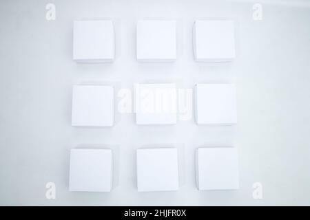 Top view of white carton gift boxes arranged next to one another on a white background Stock Photo