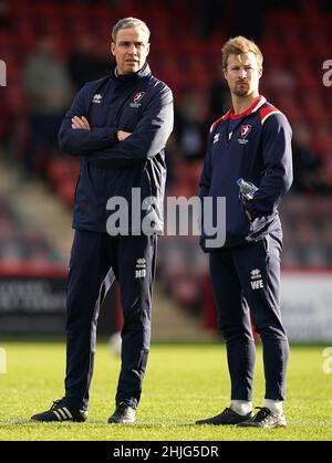 Cheltenham Athletic manager Michael Duff (left) and first team coach Wade Elliott before the Sky Bet League One match at The Jonny-Rocks Stadium, Cheltenham. Picture date: Saturday January 29, 2022. Stock Photo