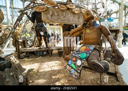Madrid, Spain. 29th Jan, 2022. One of the figures that make up the exhibition 'Magellan, Marilyn, Mickey and Friar Damaso. 500 years of conquistadors RockStars', by the artist Kidlat Tahimik, at the Palacio de Cristal del Parque de El Retiro in Madrid, In this exhibition made up of wooden figures Tahimik reflects on the indigenous resistance and the cultural imposition of the imperial powers, while at the same time he proposes, with irony, an alternative narration of History to the one written by the victors. Credit: ZUMA Press, Inc./Alamy Live News Stock Photo