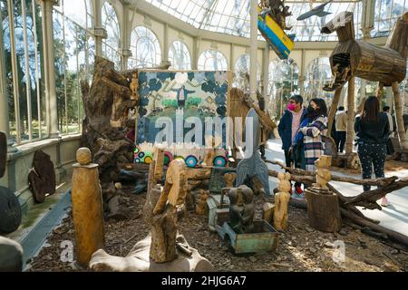 Madrid, Spain. 29th Jan, 2022. An overview of the figures that make up the exhibition 'Magellan, Marilyn, Mickey and Friar Damaso. 500 years of conquistadors RockStars', by the artist Kidlat Tahimik, at the Palacio de Cristal del Parque de El Retiro in Madrid, In this exhibition made up of wooden figures Tahimik reflects on the indigenous resistance and the cultural imposition of the imperial powers, while at the same time he proposes, with irony, an alternative narration of History to the one written by the victors. Credit: ZUMA Press, Inc./Alamy Live News Stock Photo