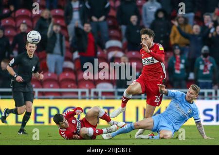 MIDDLESBROUGH, UK. JAN 29TH Coventry City's Liam Kelly tackles Middlesbrough's Matt Crooks as Middlesbrough's Martín Payero lays on the floor during the Sky Bet Championship match between Middlesbrough and Coventry City at the Riverside Stadium, Middlesbrough on Saturday 29th January 2022. (Credit: Michael Driver | MI News ) Credit: MI News & Sport /Alamy Live News Stock Photo