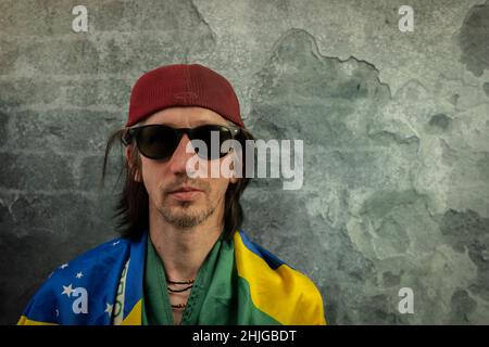 Bearded man portrait near old color stone brick wall Stock Photo