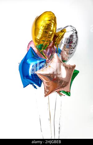 Foil balloon air balloons of heart shaped and stars. Love concept. Holiday and celebration. Valentine's Day or wedding, bachelorette party decoration. Stock Photo