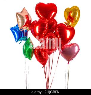 Foil balloon air balloons of heart shaped and stars. Love concept. Holiday and celebration. Valentine's Day or wedding, bachelorette party decoration. Stock Photo
