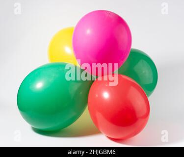 Colorful round balloons bunch isolated on white background. Birthday, anniversary, jubilee concept. Stock Photo