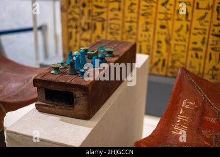 Cairo Egypt December 2021 Ancient Egyptian board game Senet, played in the ancient times and still today. Blue stone figurines shown Stock Photo