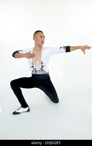 Young man salsa dancer in the studio Stock Photo