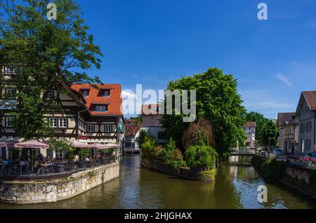 Esslingen am Neckar, Baden-Württemberg, Germany: View from the Agnesbrücke over the Roßneckarkanal on beer garden restaurant. Stock Photo