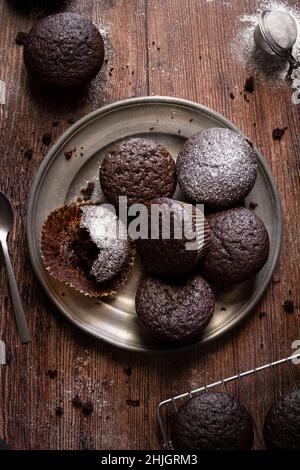 Homemade chocolate muffins on wood table Stock Photo