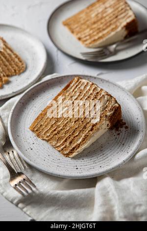 Russian Honeylayer cake on a white background Stock Photo