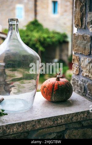 Small pumpkin outside on the wall Stock Photo