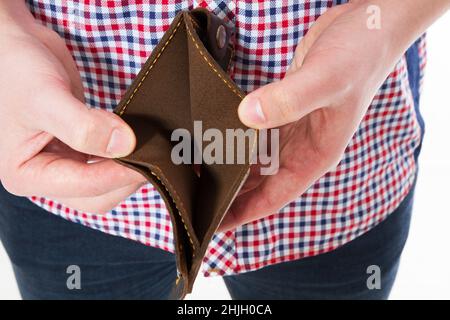 Bankruptcy - Male Person holding an empty wallet, hand holding Empty Wallet Stock Photo