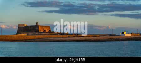 View of Castillo de San Gabriel bathed in golden light at sunset, Arracife, Lanzarote, Canary Islands, Spain, Europe Stock Photo