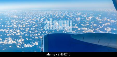 View of airplane engine and clouds over the sea, Atlantic Ocean, Europe Stock Photo