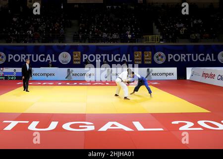 Lisbon. 29th Jan, 2022. Sod-Erdene Gunjinlkham (blue) of Mongolia competes with Joan-Benjamin Gaba of France during the men's -73 kg match of Judo Grand Prix Portugal 2022 at the Municipal Sports Complex in Almada, Portugal on Jan. 29, 2022. Credit: Pedro Fiuza/Xinhua/Alamy Live News Stock Photo