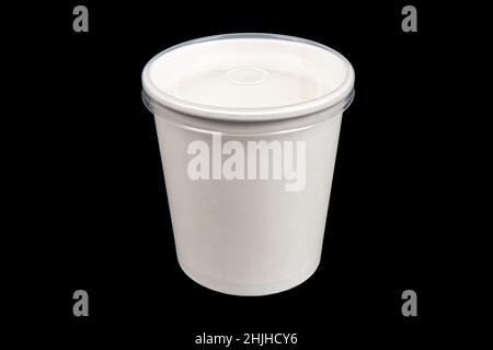 Side view white empty disposable paper cup isolated on black background. Paper cup isolated. Paper cup with cap Stock Photo