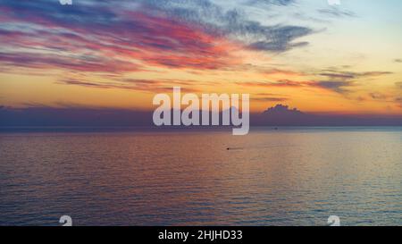 Seascape with a beautiful sunset over the water surface. Stock Photo