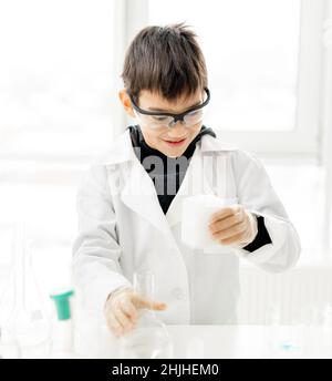 School boy in chemistry class Stock Photo