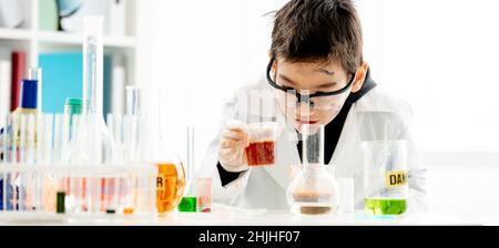 School boy in chemistry class Stock Photo