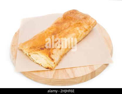 Placinta cake filled with a soft cheese as a romanian cuisine. Isolated on a white background. Stock Photo