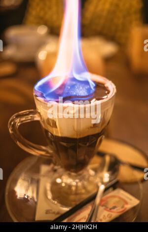 Delicous dessert in a cup with flames in a fancy restaurant Stock Photo