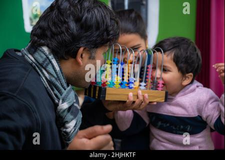 son and father and mother lovingly playing with each other and having fun . Stock Photo
