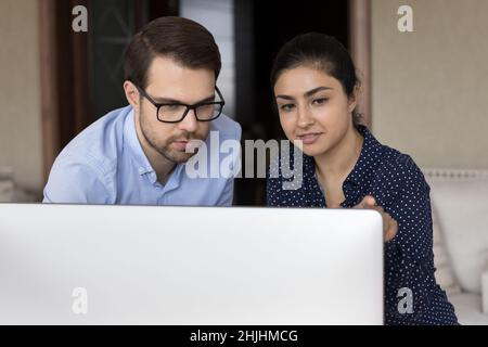 Focused multiracial business people working on computer. Stock Photo