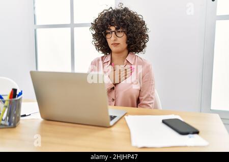 Young middle east woman having video call communicating with deaf language at office Stock Photo