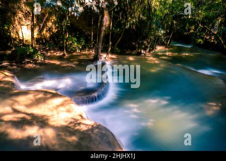 Long exposure exotic beautiful tropical deep rainforest waterfall Fresh turquoise waterfalls in deep forest of Huay Mae Khamin waterfall in the nation Stock Photo