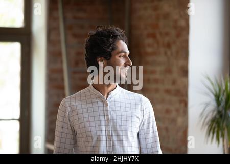 Millennial business startup leader guy standing in loft property space Stock Photo