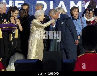 File photo dated 4/6/2012 of Queen Elizabeth II being greeted by her son, the Prince of Wales, as she is joined on stage with the rest of the Royal family and performers at the end of the Diamond Jubilee Concert at Buckingham Palace, London. Issue date: Sunday January 30, 2022. Stock Photo