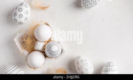 Simple Easter eggs with different pattern and feathers Stock Photo