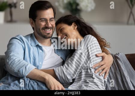 Beautiful couple in love hugging laughing feel carefree Stock Photo