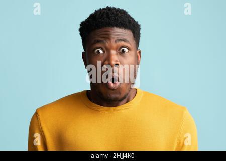 Shocked black man looking at camera, closeup photo Stock Photo