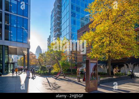 View of Bishops Square and the Gherkin visible through trees, London, England, United Kingdom, Europe Stock Photo