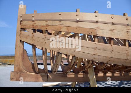 A classical wooden fishing boat in the final stage of construction by an association dedicated to vintage boats, Douarnenez, Brittany. Stock Photo