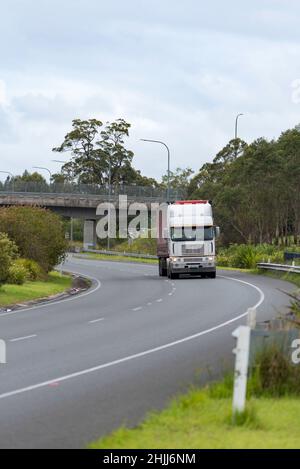 A semitrailer truck travelling north on the Pacific Highway (M1) Australia, in a 100km zone near Nabiac, New South Wales Stock Photo