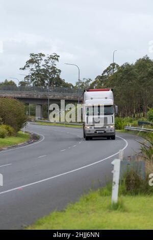 A semitrailer truck travelling north on the Pacific Highway (M1) Australia, in a 100km zone near Nabiac, New South Wales Stock Photo