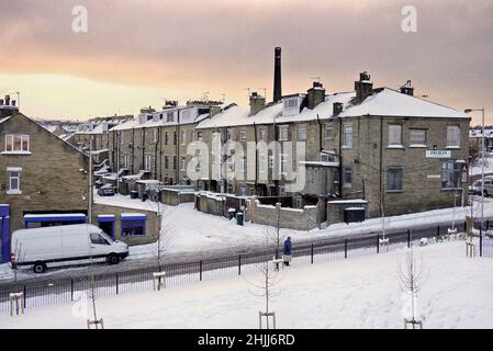 Snowy urban winter scene in Bradford looking across to terrace house's from Park Lane Park on Roundhill street in the winter of 2010 Stock Photo